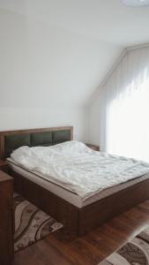 מיטה או מיטות בחדר ב-Villa Royal - Jezerc
