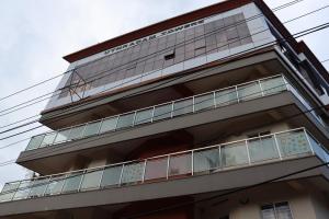 a building with balconies on the side of it at Uthradam towers in Trivandrum