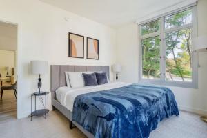 a white bedroom with a large bed with a blue blanket at Mountain View 2br w bbq lounge roof nr shops SFO-1417 in Los Altos +23 photos