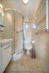 Kúpeľňa v ubytovaní Apartamenty Gromada Międzyzdroje + 37 fotografií