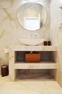 a bathroom with a sink and a mirror at Plaka athens 1 bedroom 4 persons apartment by MPS in Athens