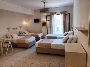 Argostoli Rooms tesisinde bir odada yatak veya yataklar