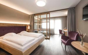 Posteľ alebo postele v izbe v ubytovaní Familienhotel Viktoria
