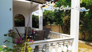 a balcony of a house with a table and chairs at Skyros Euphoria House in Skiros