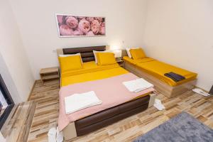 Postel nebo postele na pokoji v ubytování APARTEMENT VIVA