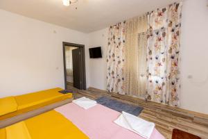 Postel nebo postele na pokoji v ubytování APARTEMENT VIVA