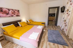 Postel nebo postele na pokoji v ubytování APARTEMENT VIVA