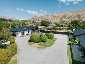 an aerial view of a house with a driveway at 2 - Handsome and Sunkissed on the Doorstep to Wanaka in Wanaka