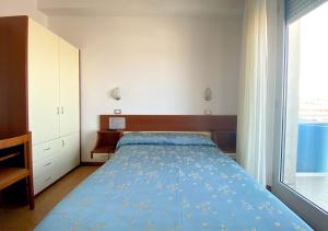 Кровать или кровати в номере Hotel Sayonara