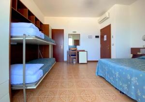 Кровать или кровати в номере Hotel Sayonara
