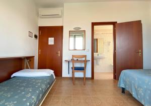 Кровать или кровати в номере Hotel Sayonara