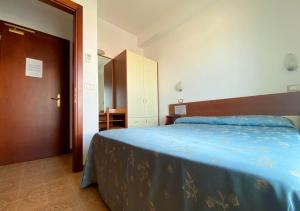 Кровать или кровати в номере Hotel Sayonara