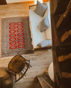 a living room with a couch and a rug at Casa Boixareu in La Pobla de Segur +31 photos