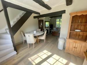 a kitchen and dining room with a table and chairs at Railway Cottage - Pet friendly with parking in Ripon