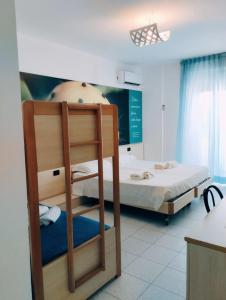 Postel nebo postele na pokoji v ubytování Apulia Hotel Ugento Cala Blu