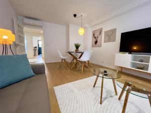 a living room with a couch and a table at Balnea O Pazo in Mondariz-Balneario