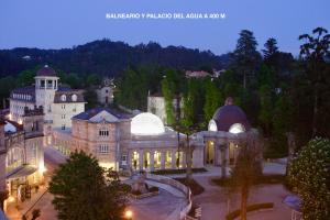 an aerial view of a large building at night at Balnea O Pazo in Mondariz-Balneario