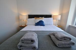 Un pat sau paturi într-o cameră la May View