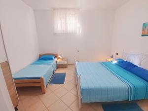 Ένα ή περισσότερα κρεβάτια σε δωμάτιο στο Apartment Katarina