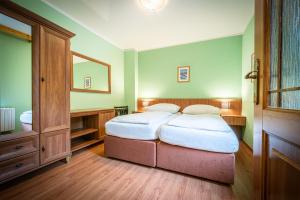 Postel nebo postele na pokoji v ubytování Hotel Sepetná