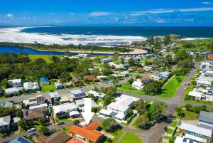 an aerial view of a small town next to the ocean at Sunny Corner Holiday Home in Crescent Head