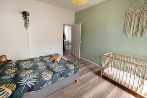 Posteľ alebo postele v izbe v ubytovaní LD-Location Hôtel