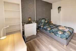Posteľ alebo postele v izbe v ubytovaní LD-Location Hôtel