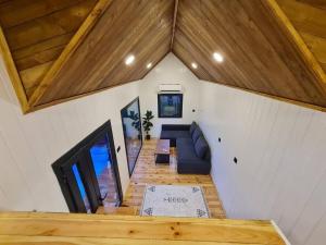 a living room with a couch and a tv at Antik Tiny House in İznik