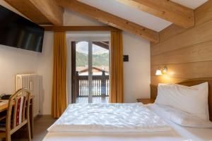 Postel nebo postele na pokoji v ubytování Hotel Ramon