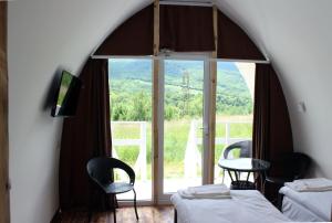 a room with two beds and a table and a window at Glamping Eco Valley in Shahumyan