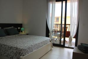 Ένα ή περισσότερα κρεβάτια σε δωμάτιο στο Beautiful apartment with pool in Palm Mar +169 φωτογραφίες