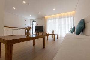 TV a/nebo společenská místnost v ubytování Guest House Fojo dos Lobos