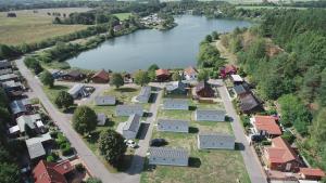 an aerial view of a small village next to a river at Mobilheim Küstenschwalbe am Kransburger See 553 in Kransburg