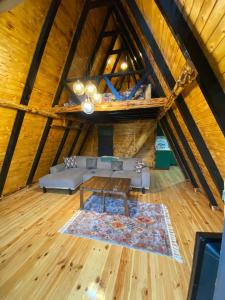 a living room with a couch and a table in a attic at Bungalow In Iznik in İznik