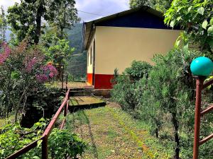 a house with a fence next to a garden at New Araniko Resort (P) Ltd in Chautara