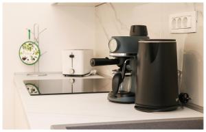 a coffee maker sitting on a counter in a kitchen at Apartment Ballin in Primošten