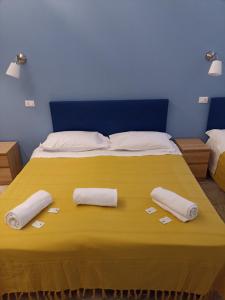 a bed with two white pillows on top of it at Affittacamere Novoli in Florence