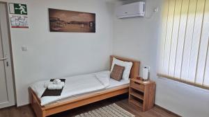 Postel nebo postele na pokoji v ubytování Apartmani - Kladovski Konak