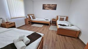 Postel nebo postele na pokoji v ubytování Apartmani - Kladovski Konak
