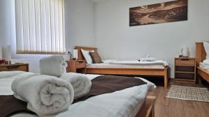Postel nebo postele na pokoji v ubytování Apartmani - Kladovski Konak