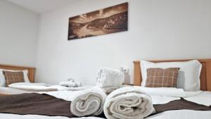 Postel nebo postele na pokoji v ubytování Apartmani - Kladovski Konak