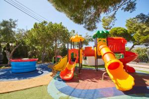 a playground with a slide and a play equipment at Alannia Costa Dorada in Platja de l’Almadrava