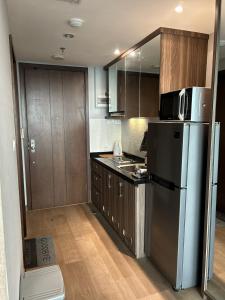 Kuchyň nebo kuchyňský kout v ubytování U Residence 2 Studio Apartment POOL VIEW