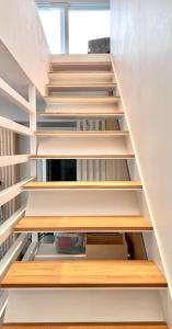 a staircase with wooden shelves in a room at ALC1 Ampio appartamento 4 persone in San Giovanni in Marignano