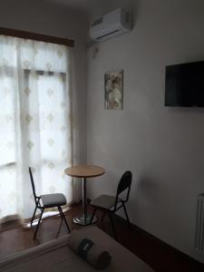 TV o dispositivi per l'intrattenimento presso Guest House Buche 219