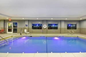 a large swimming pool in a hotel room at Tru By Hilton Corpus Christi South Padre Island Dr in Corpus Christi