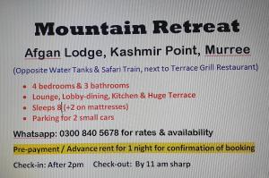 ein Zeichen, das einen Rückzugsort in den Bergen liest, africanische Lodge kaschmirinianischer Punkt in der Unterkunft Mountain Retreat at Afgan Lodge in Murree
