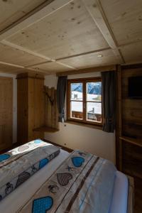 Voodi või voodid majutusasutuse Almgasthaus Glocknerblick toas