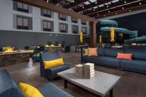 a hotel lobby with couches and a fire pit at Hampton Inn & Suites Rapid City Rushmore, SD in Rapid City