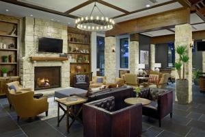 a living room with couches and a fireplace at The Bevy Hotel Boerne, A Doubletree By Hilton in Boerne